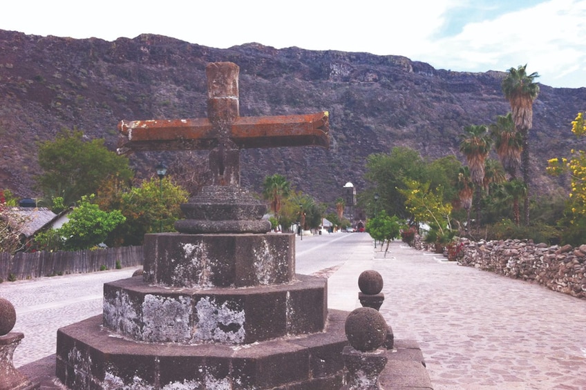 Short stone cross at San Javier Mission