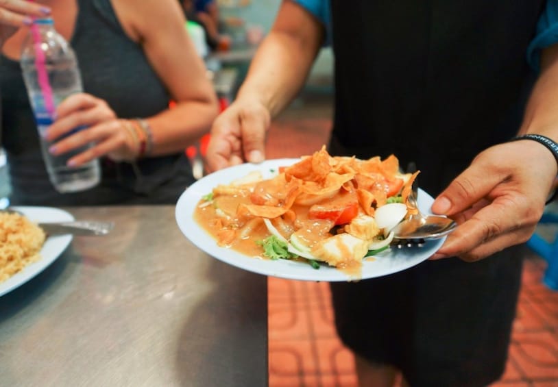 Person holding a delicious food plate in Bangkok 