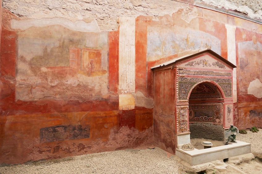Pompeii building with small covered fountain