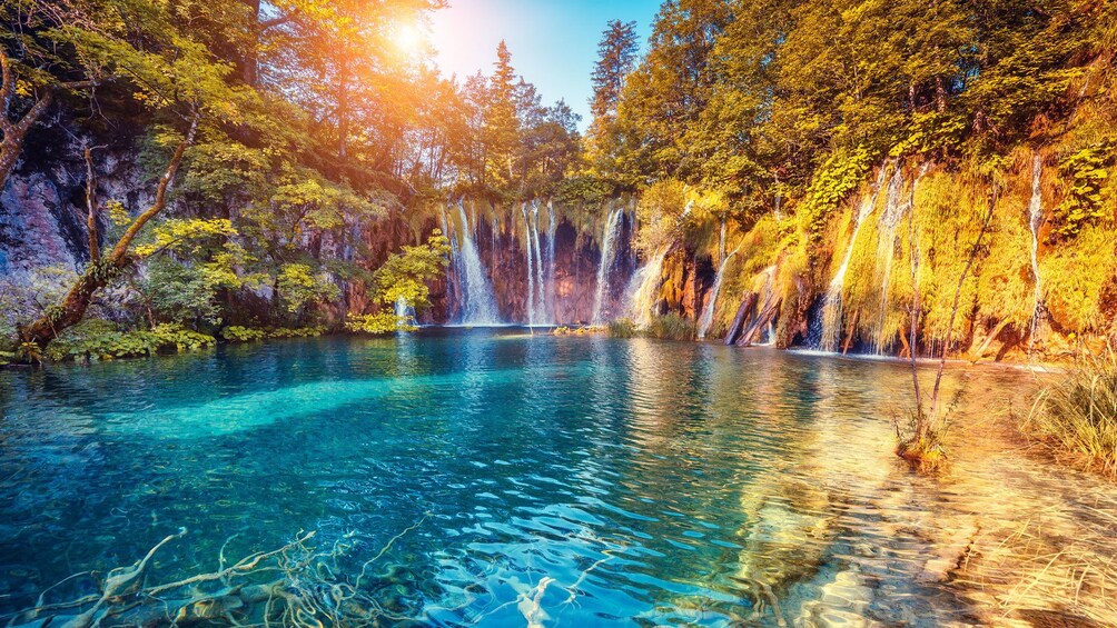 Sun shines on waterfalls and lakes in Plitvice Lakes National Park