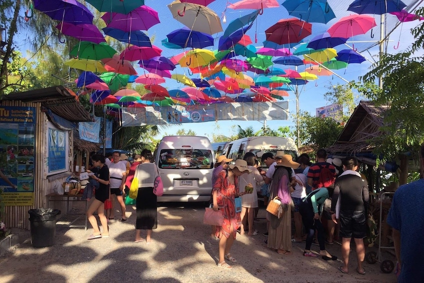 Tourists line up at food stalls and trucks on island in Thailand
