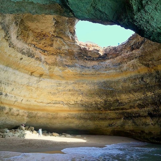 Sun coming through circular opening at Benagil Caves