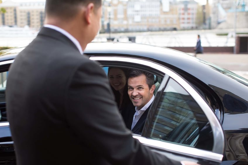 Man entering a private chauffeured car in London