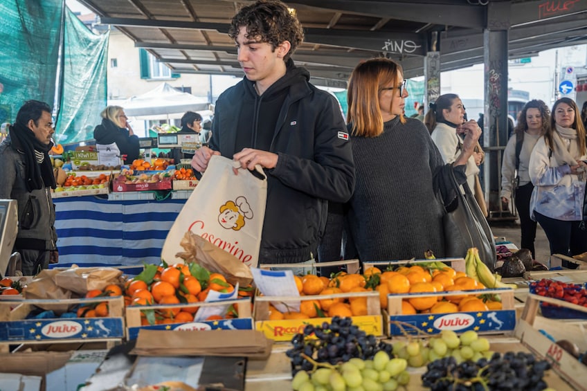 Market tour and dining experience at a Cesarina's home in Viareggio