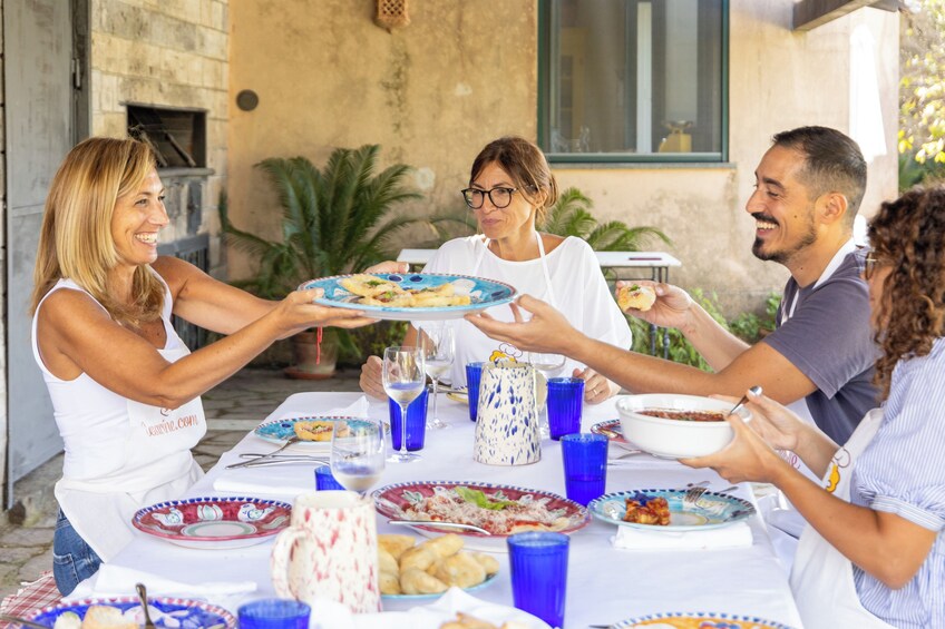 Market tour and dining experience at a Cesarina's home in Taormina