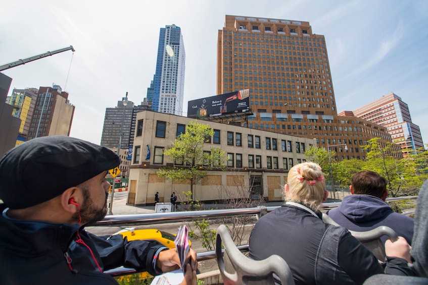 Guests aboard the City Sightseeing hop-on hop-off bus in New York City 