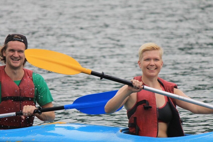 Man and women kayak near Cat Ba Island