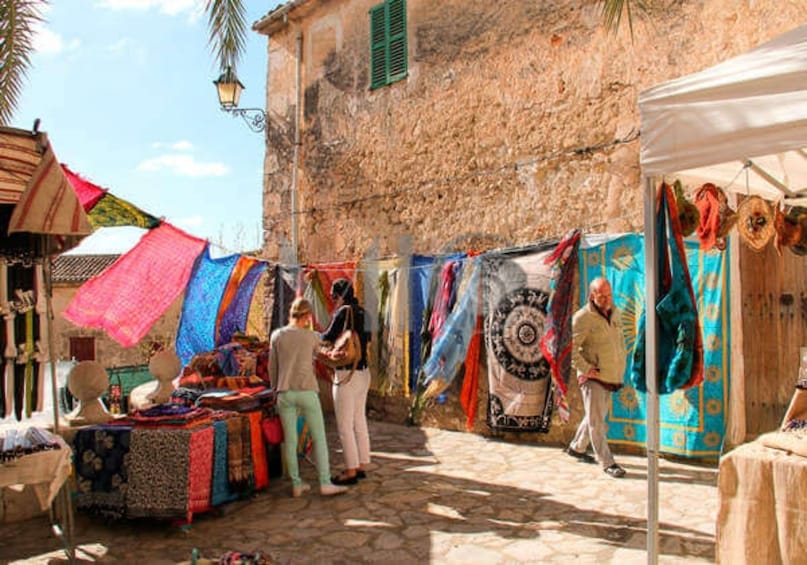 Craft fair with colorful fabric in Cap de Formentor