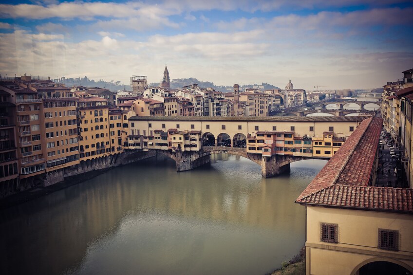 Landscape day view of the Ponte Vecchio Closed-spandrel arch bridge in Florence, Italy