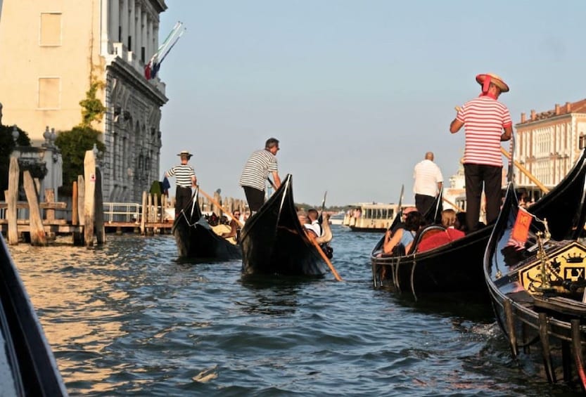 Guests on a gondola tour in Venice