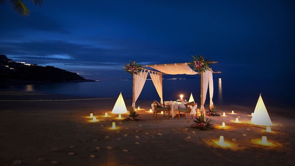 Dining table on the beach in Thailand at night