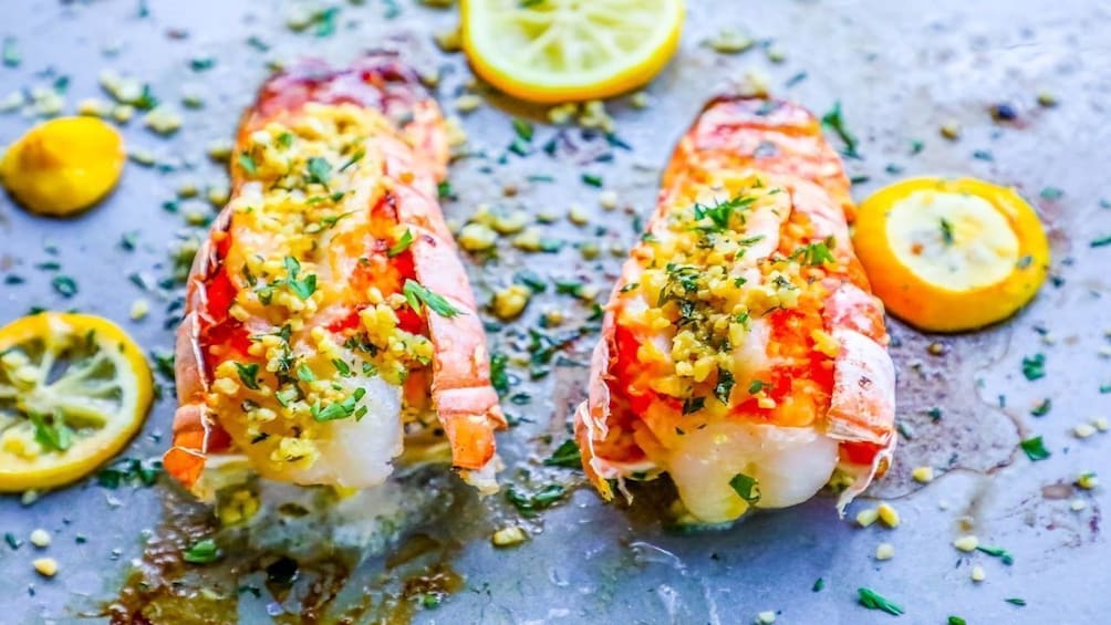 Seasoned shrimp surrounded by slices of lemons