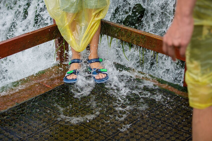 Guest getting feet and sandals wet from visiting Niagara Falls 