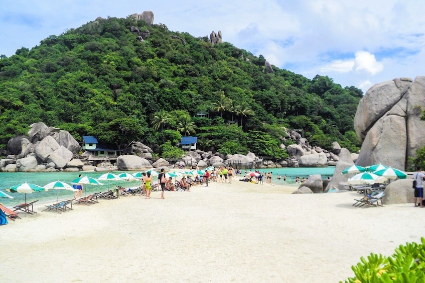 Tourists on secluded beach in Thailand