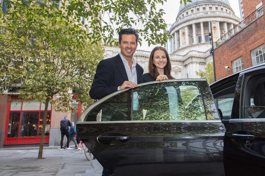 Couple getting into a car in London