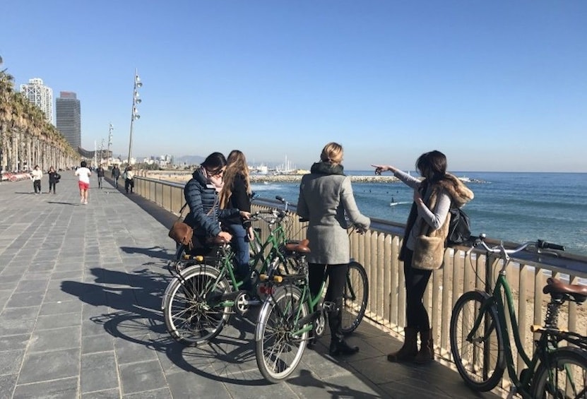 Bikers stop on waterfront plaza in Barcelona