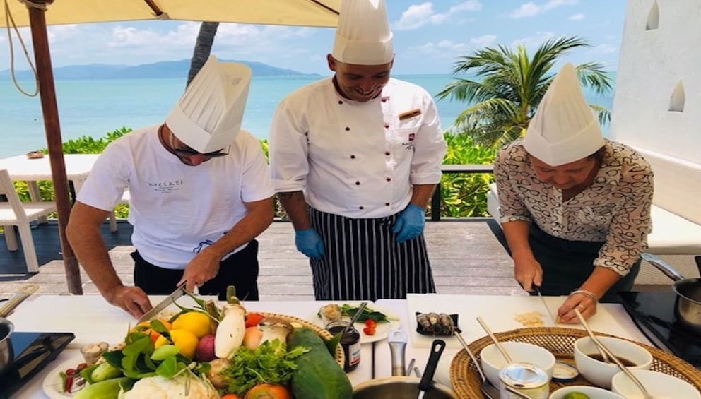 Thai Chefs prepare food at a resort