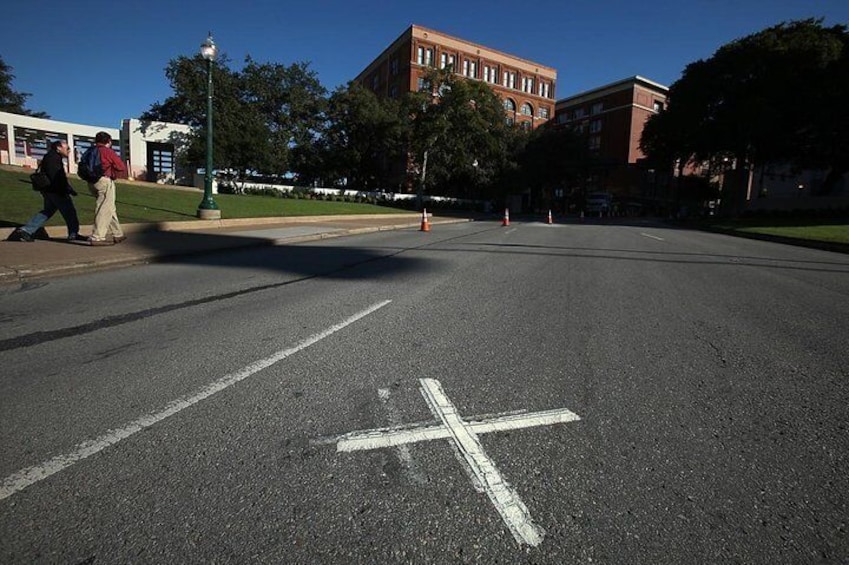 The presidential motorcade was driving through the crowd-lined Dealey Plaza when shots were fired; it has since become a National Historic Landmark.
