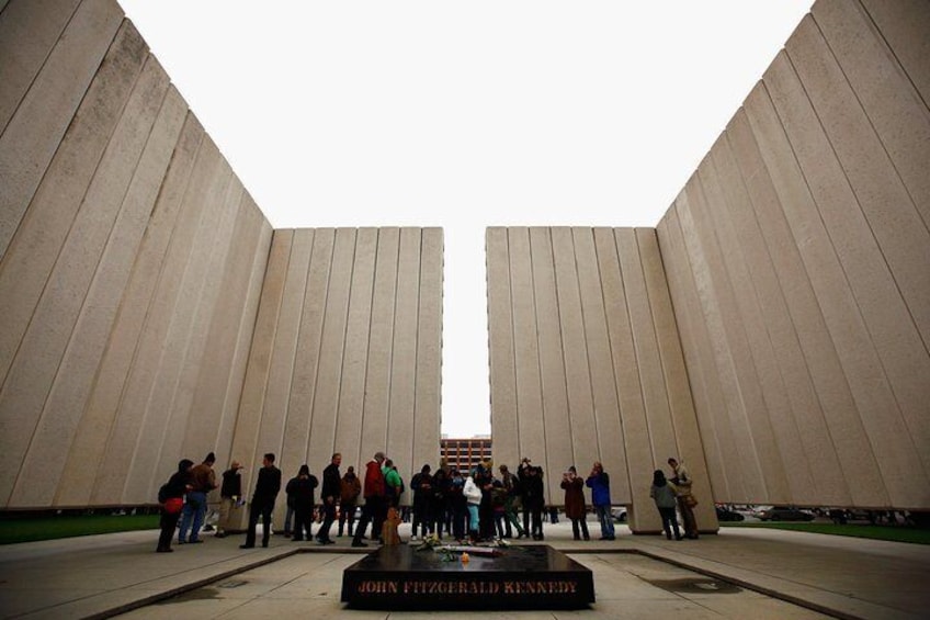 Visitors at the JFK Memorial Plaza. The memorial is located in the West End Historic District of downtown Dallas, Texas erected in 1970, and designed by noted architect Philip Johnson.