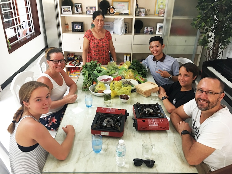 Family enjoying a meal in Hoi An, Vietnam