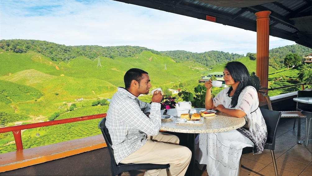 Couple enjoying tea in the Cameron Highlands
