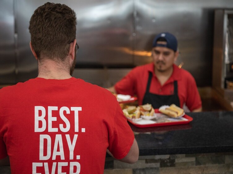 Tour guide at a food counter in Chicago