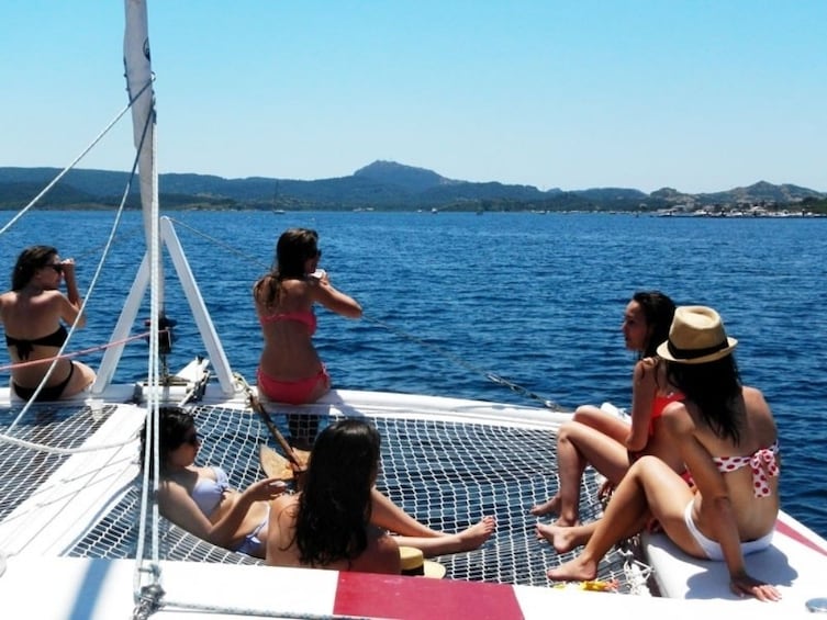 Guests on a half day Catamaran sailing trip in Northern Menorca