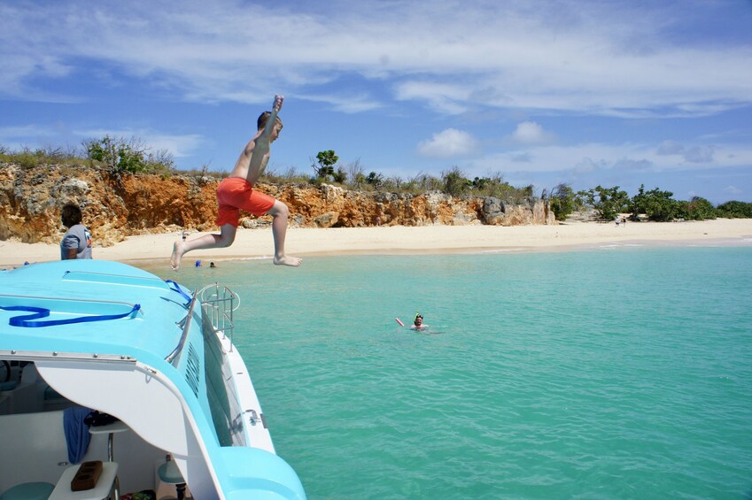 Power Catamaran Circumnavigation & Snorkeling adventure