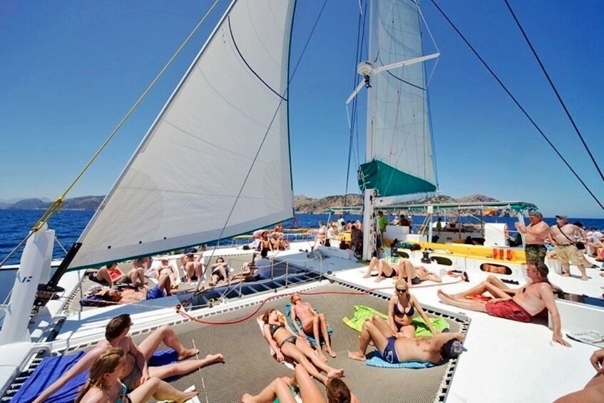 Guests sailing on board The Magic catamaran