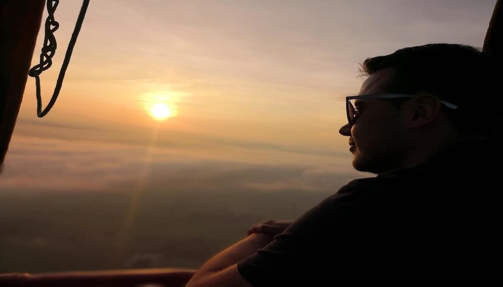 Guest enjoying the sunrise view from the Hot Air Balloon ride in Chiang Rai 