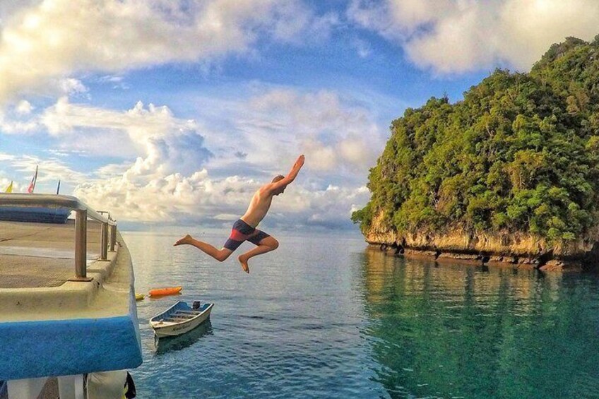 Jumping from the roof of our boat.