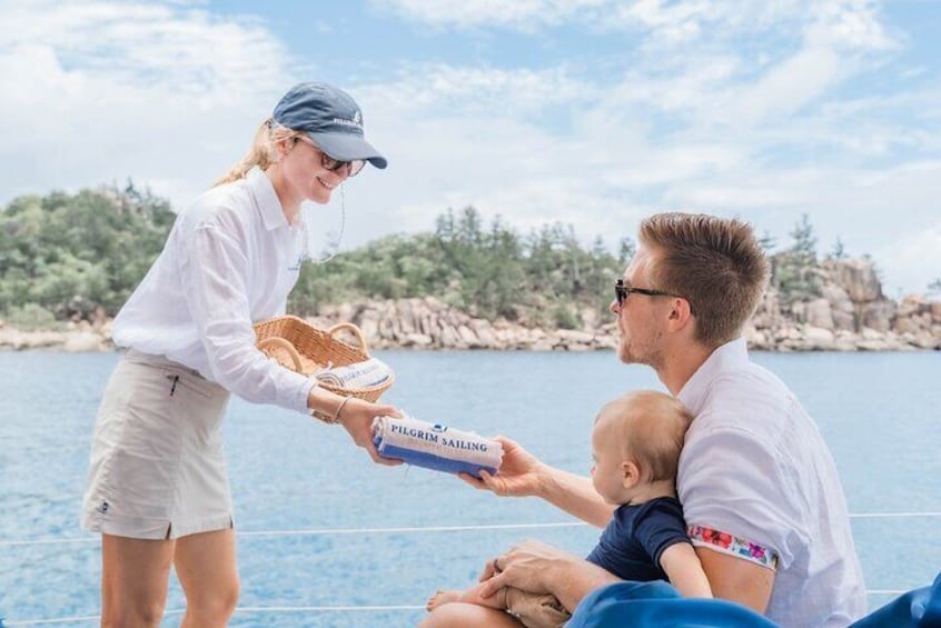 Crew presenting guests with complimentary Turkish towel.
