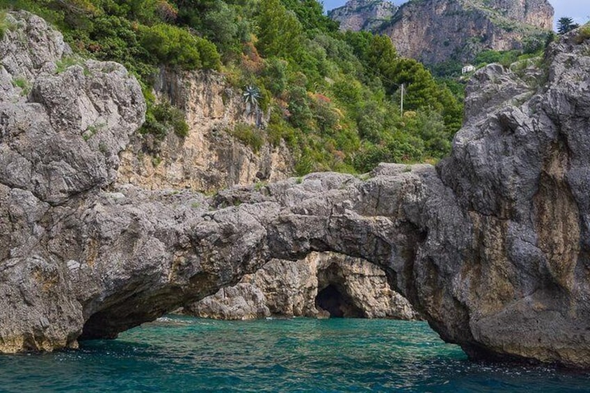 This is the Natural arch that is a famous feature of the Amalfi coast. 