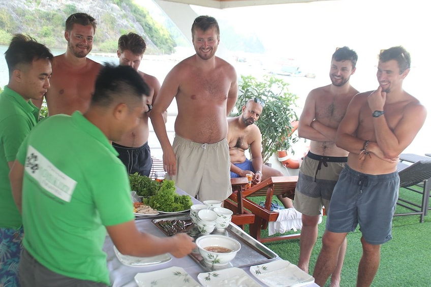 Guests getting ready to eat a Vietnamese meal aboard a boat on Lan Ha Bay 
