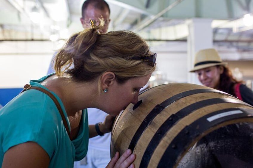 sniffing rum from the barrel