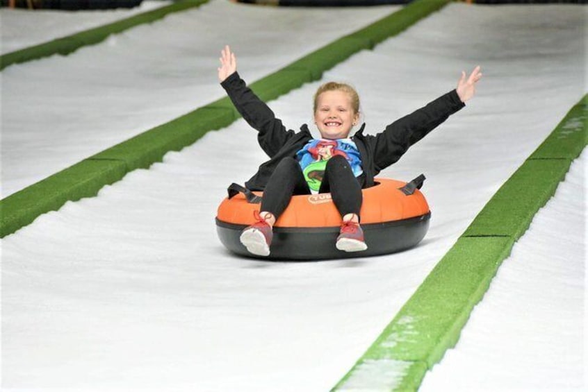 Show item 1 of 10. Pigeon Forge Snow: Indoor Snow Tubing Admission