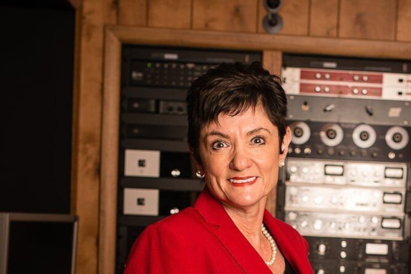 Show item 5 of 6. Foundation Chair Judy Hood in the control room