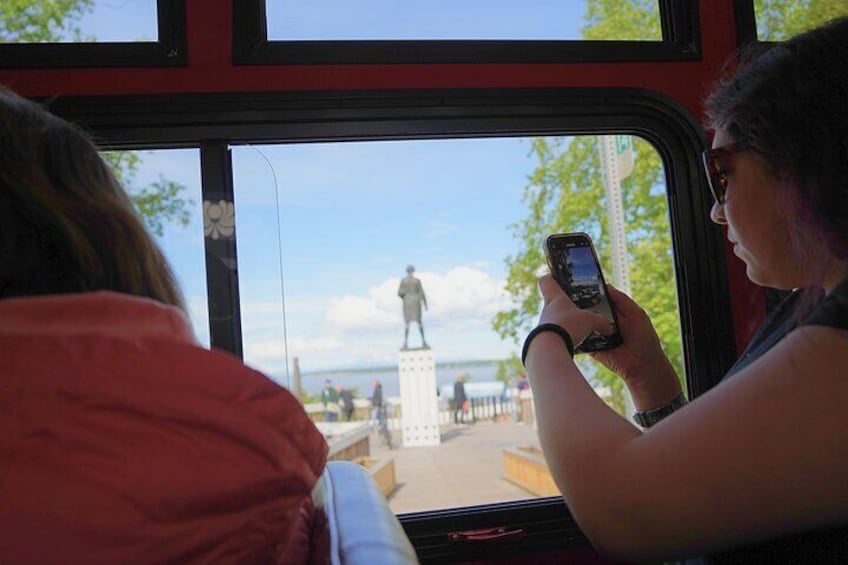 Guest taking a photo of captain cook monument
