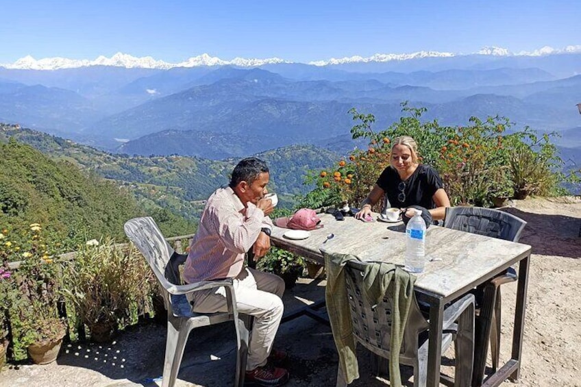 Heaving a coffee and Himalayan in the background from Nagarkot