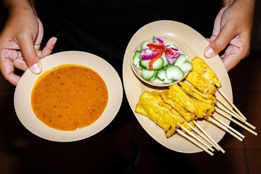 Mop up rich peanut satay with coconut-marinated skewers