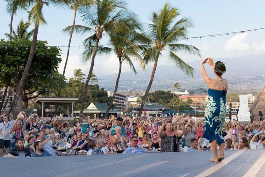As a warm-up visitors take part in pre-show activities at the Haleo Luau on the Big Island.