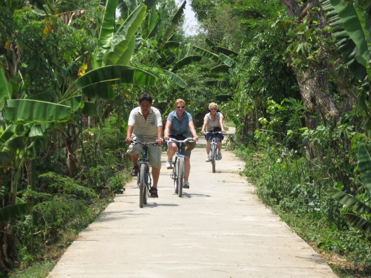 Tour group biking in Mekong