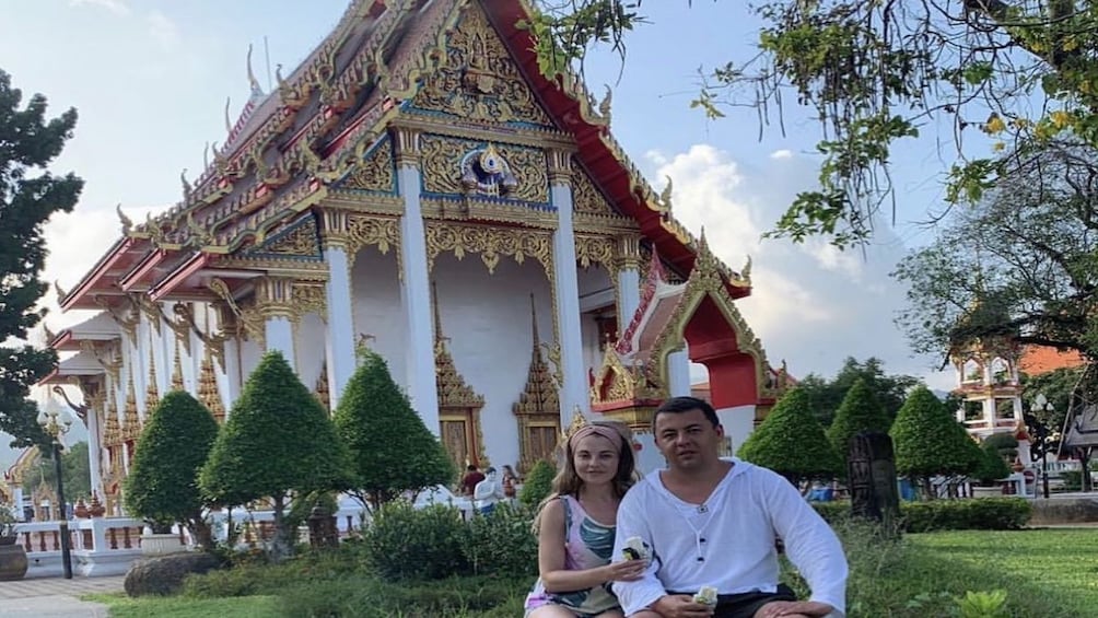 Couple visiting a temple in Phuket 
