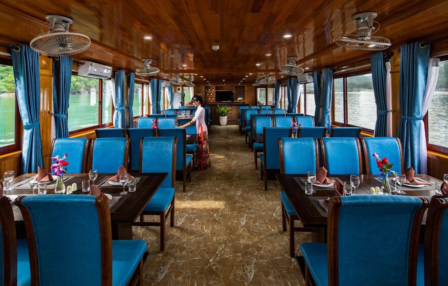 Restaurant aboard a boat floating along Halong Bay