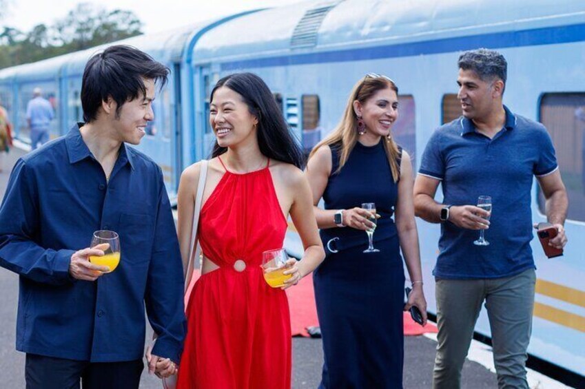 The Q Train - guests walking on the platform