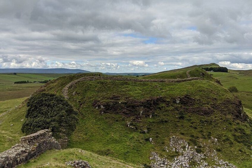 Hadrian's wall looking west with Sycamore Gap below.