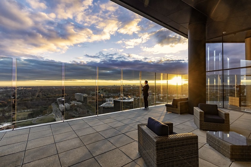 Man looking out at the view from an observation deck in Washington DC