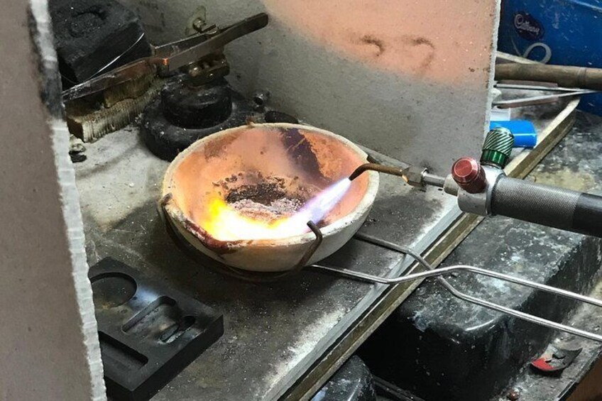 Melting the metal.