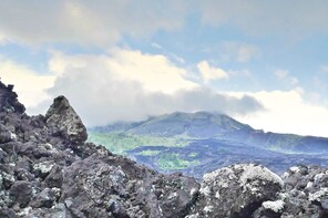 Convertible VW Winding Through Batur Caldera