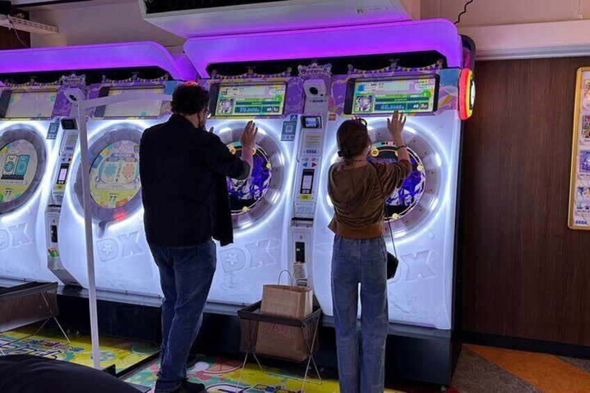 Akihabara food tour happy customers at the Game Center 